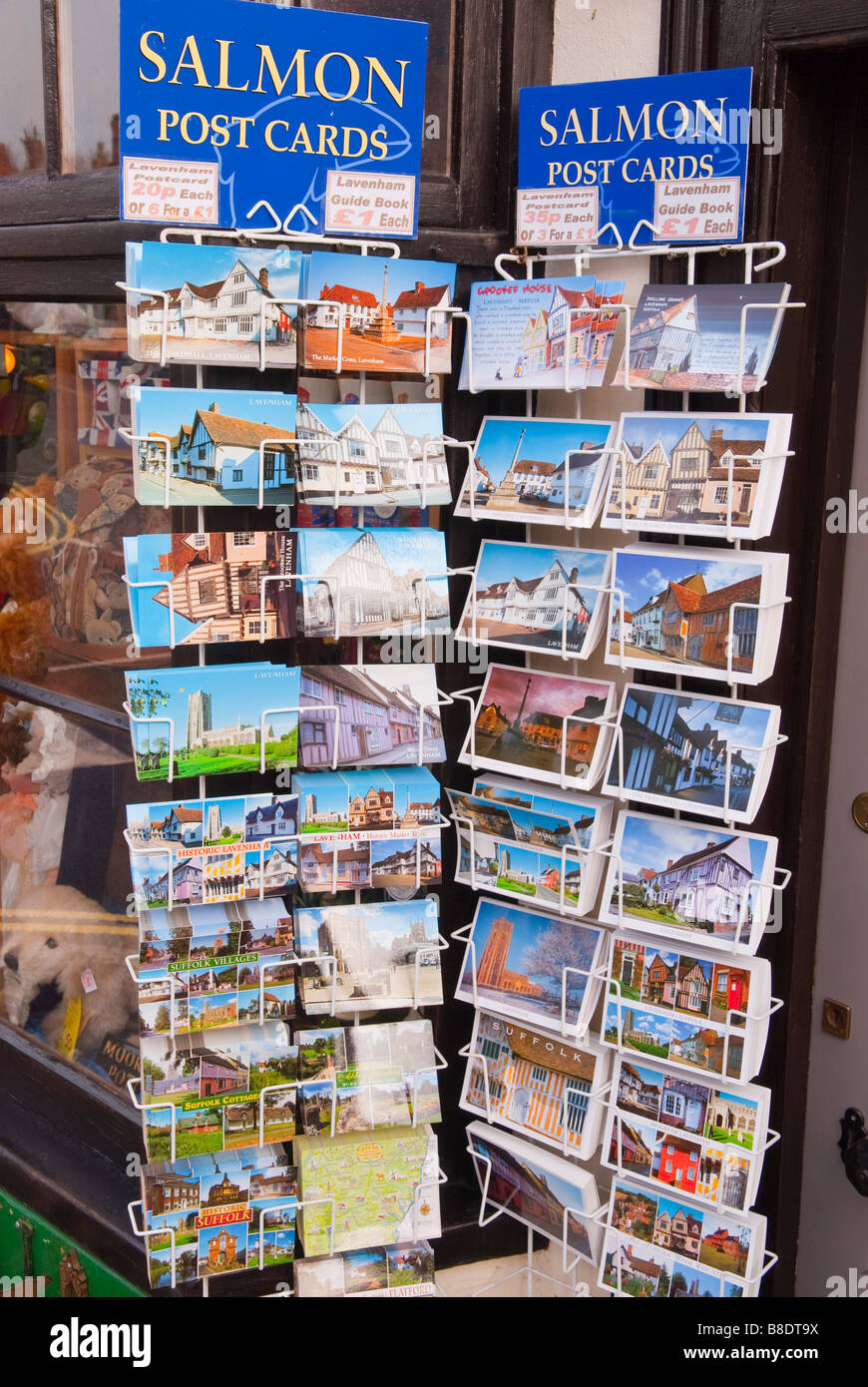 Postcards for sale on a postcard stand outside a shop store in Lavenham