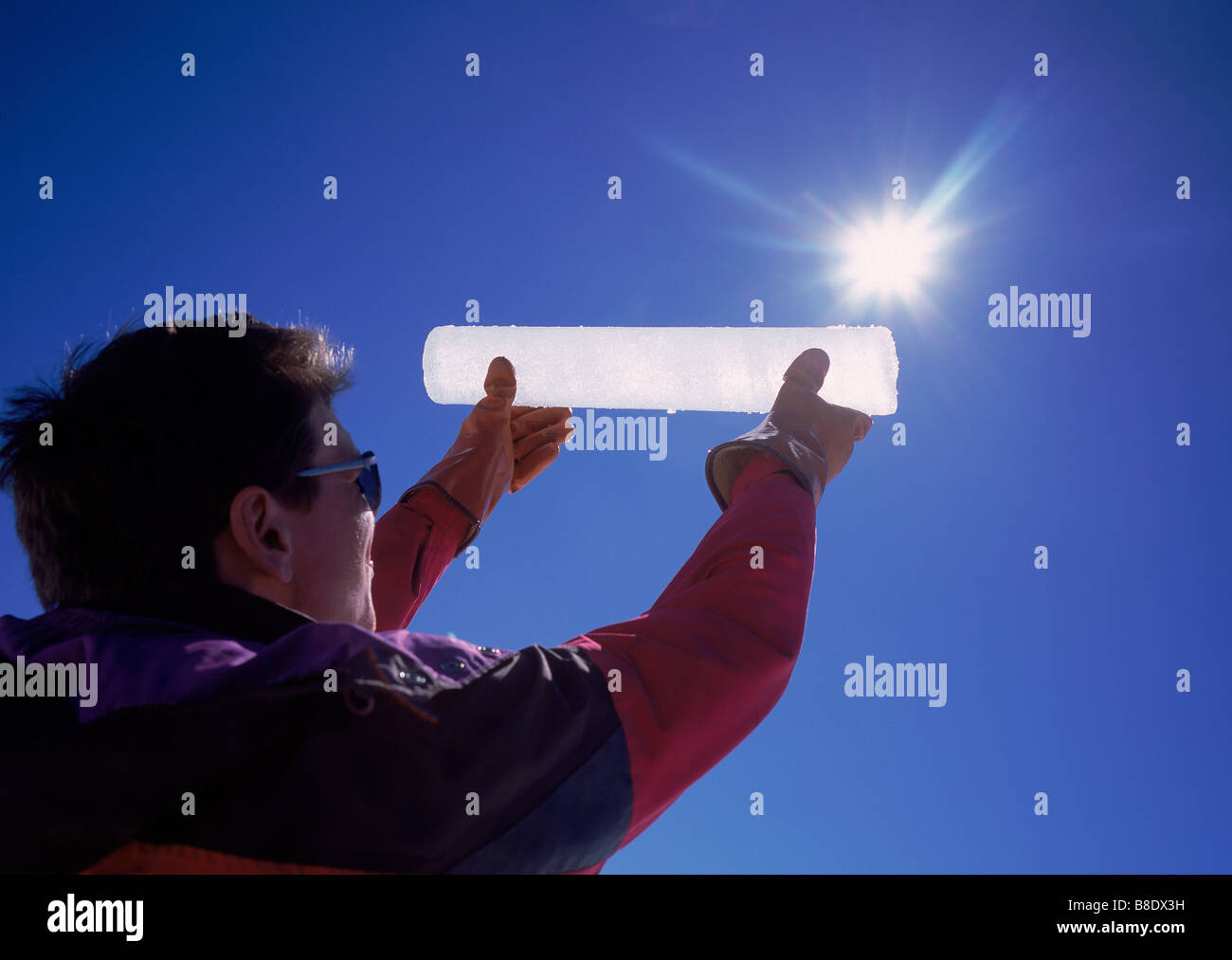 Scientist holding up ice core sample from Langjokull Ice Cap, Iceland Stock Photo
