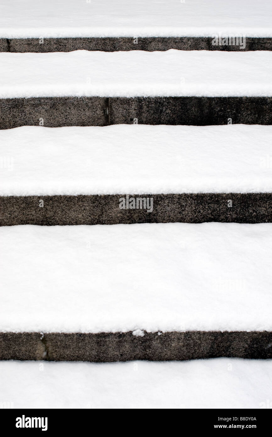 Detail view of street stairs covered with snow. Stock Photo