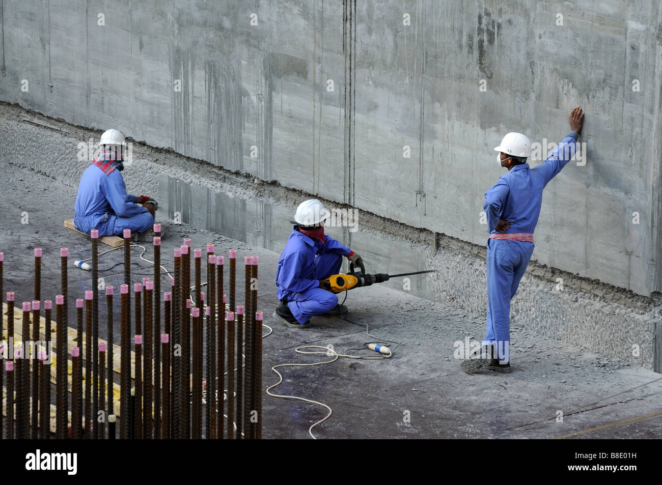 Workers at construction site Stock Photo - Alamy