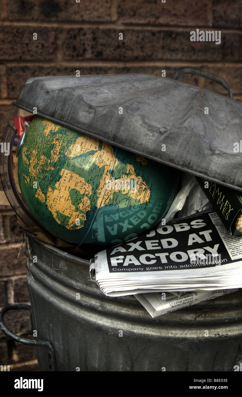 World globe in dustbin / trashcan depicting world recession with jobs axed headline.Brexit Stock Photo