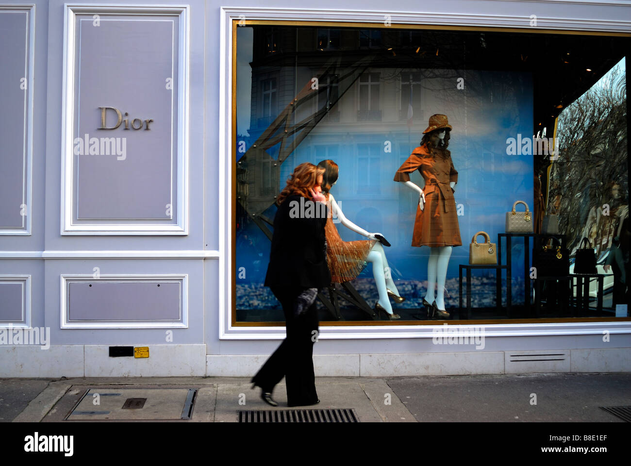 Paris, France, Luxury Window Shopping, Boutique 'Christian Dior' Store front, Woman Shopper, Walking ,Talking on Cellphone, fashion textile mannequin, Stock Photo