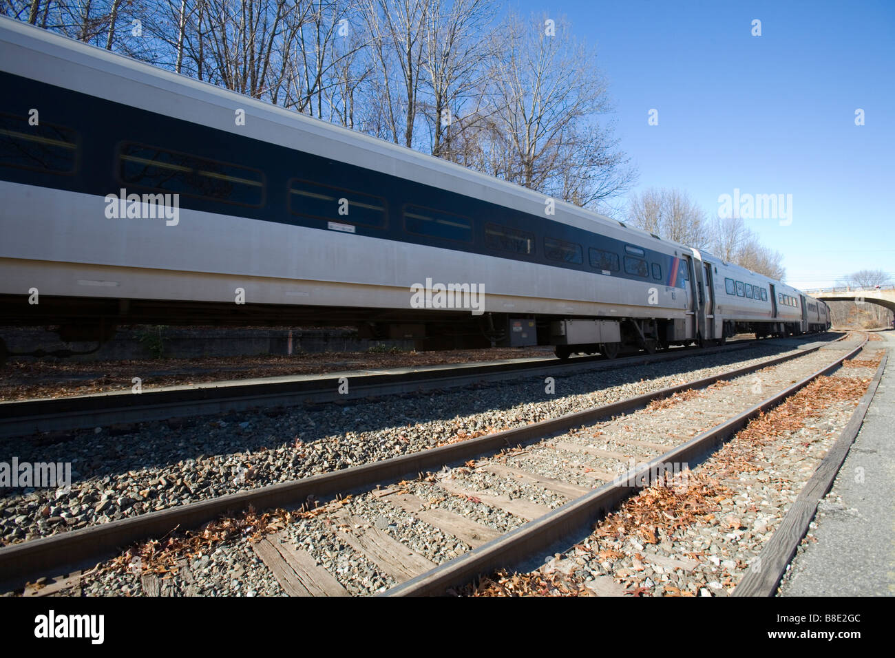 A passenger train and passenger cars in transit. Stock Photo