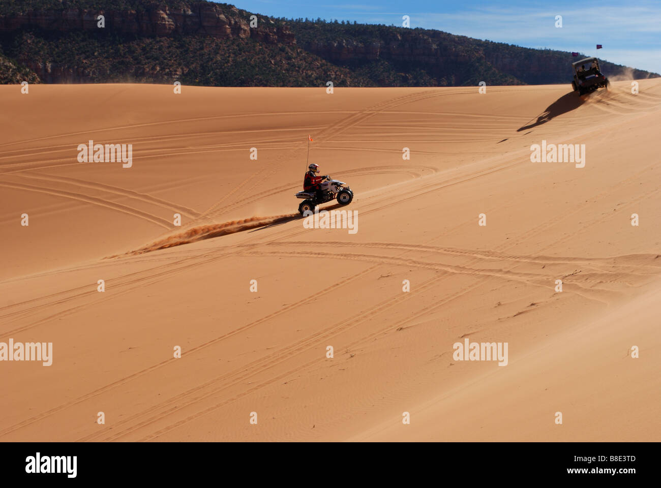 Dune buggy rides along slopes at Coral Pink sand dunes state park Utah Stock Photo