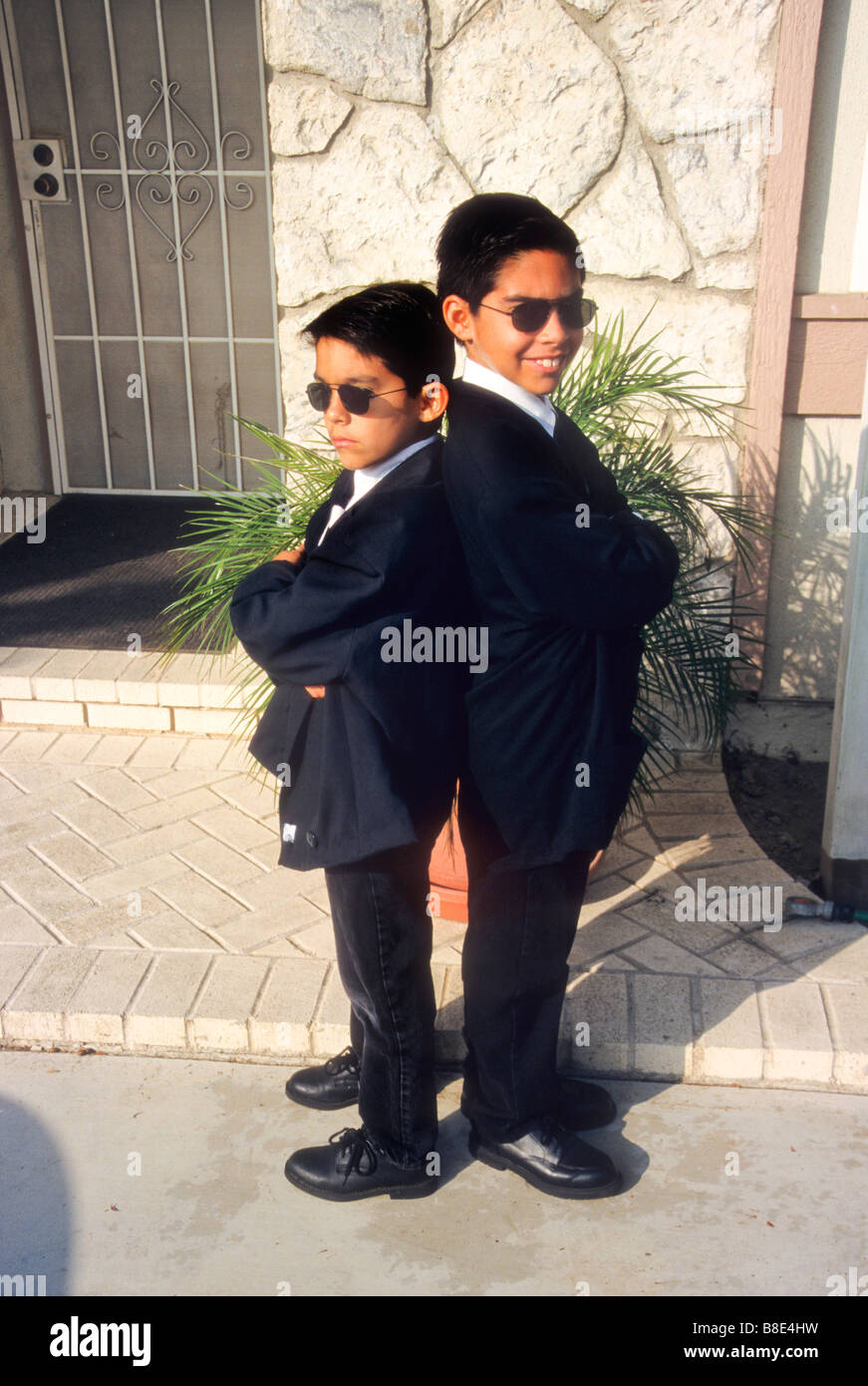 Two brothers dress as Blues Brothers for halloween Stock Photo