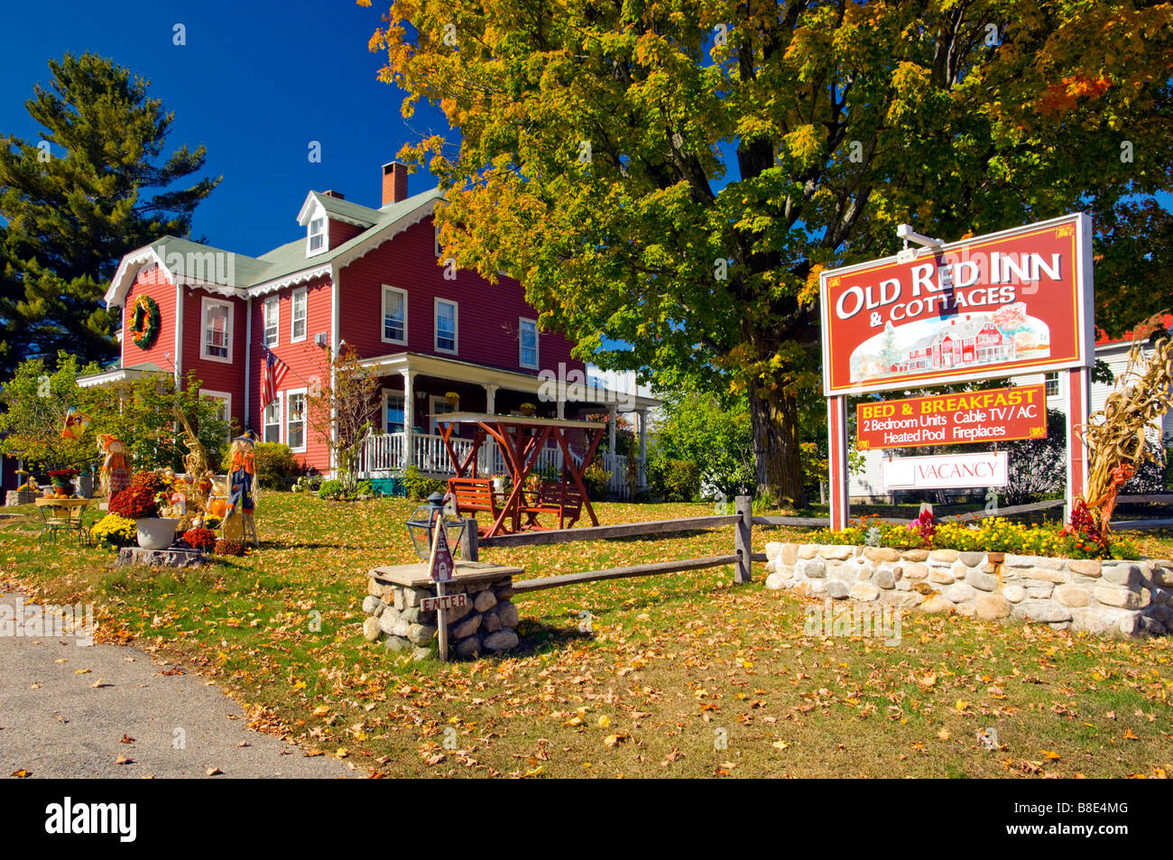 Autumn yard decor with pumpkins corn stalks and scarecrows at the Old