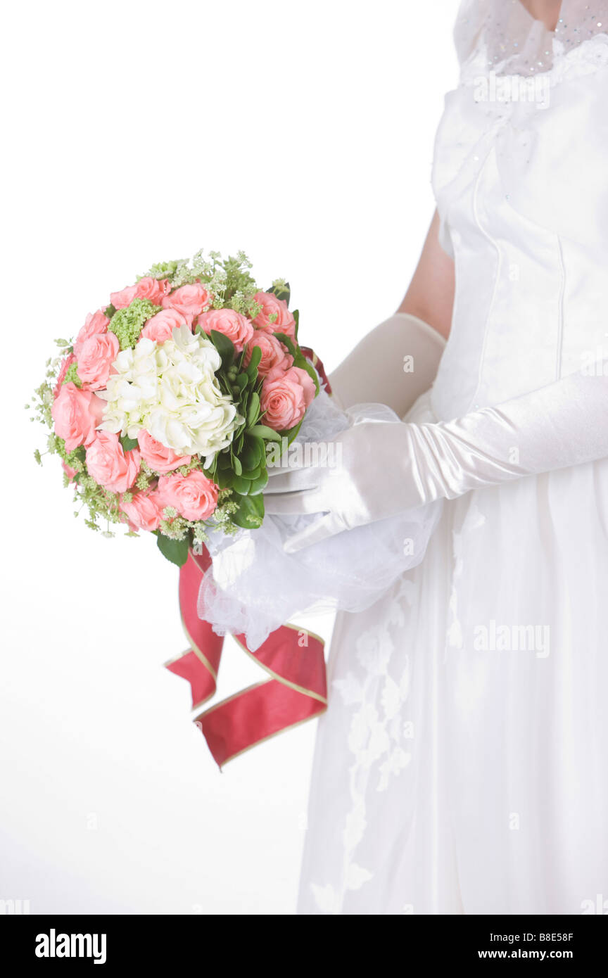Side view of bride holding wedding bouquet Stock Photo - Alamy