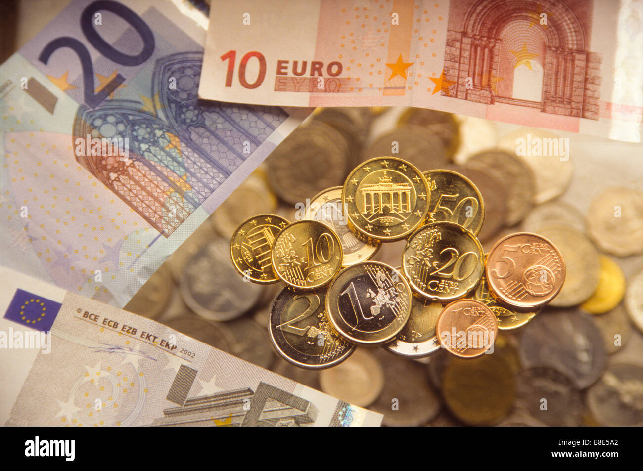 Euro coins and bills Stock Photo - Alamy