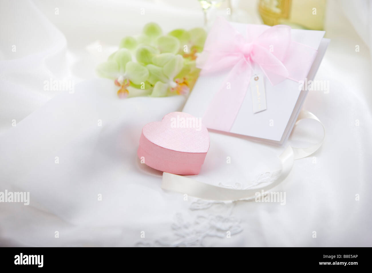 Wedding invitation jewelry box on fabric Stock Photo Alamy