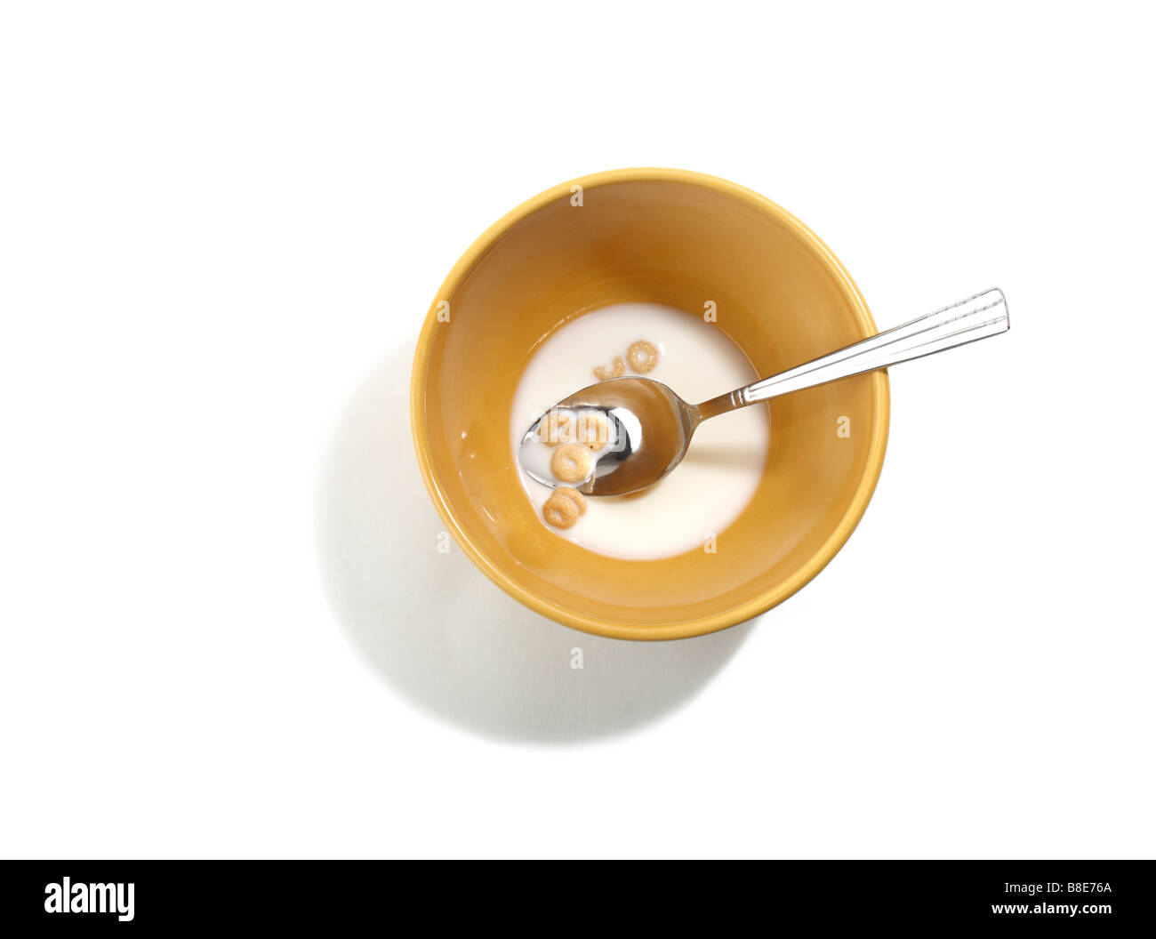 Left Over Cereal in Bowl with Spoon Stock Photo