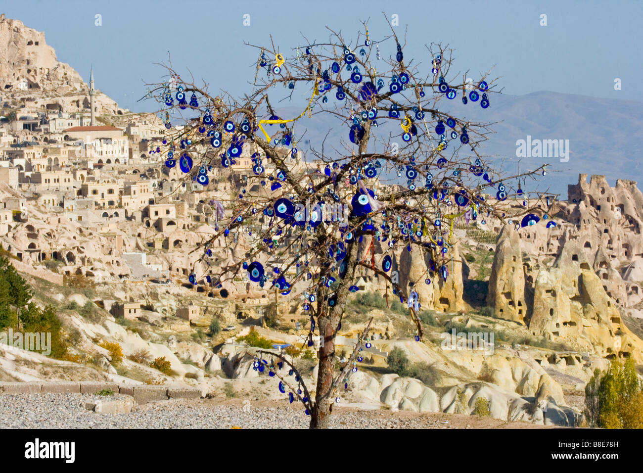 Evil Eyes Hung on a Tree in front of Uchisar in Cappadocia Turkey Stock Photo
