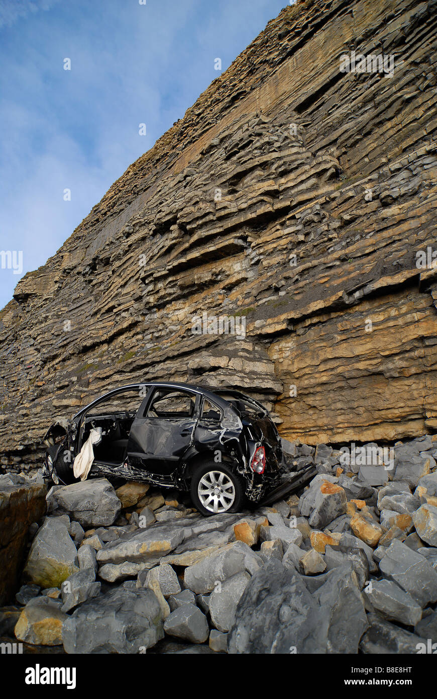 Car at bottom of cliff Stock Photo