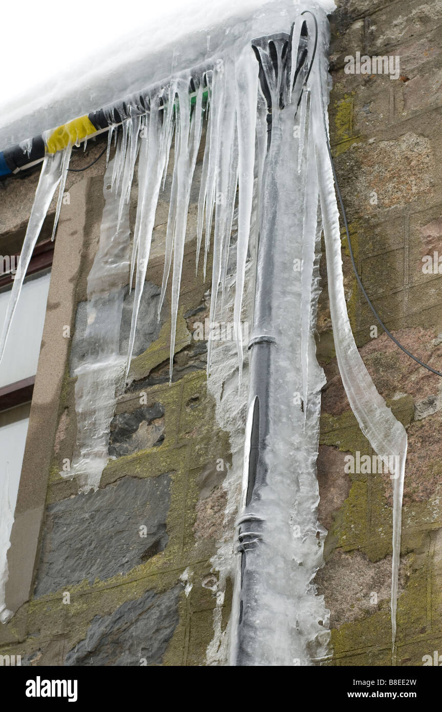 Frozen pipes adorn a building at Tomintoul Inverness-shire Highland Scotland.   SCO 2180 Stock Photo