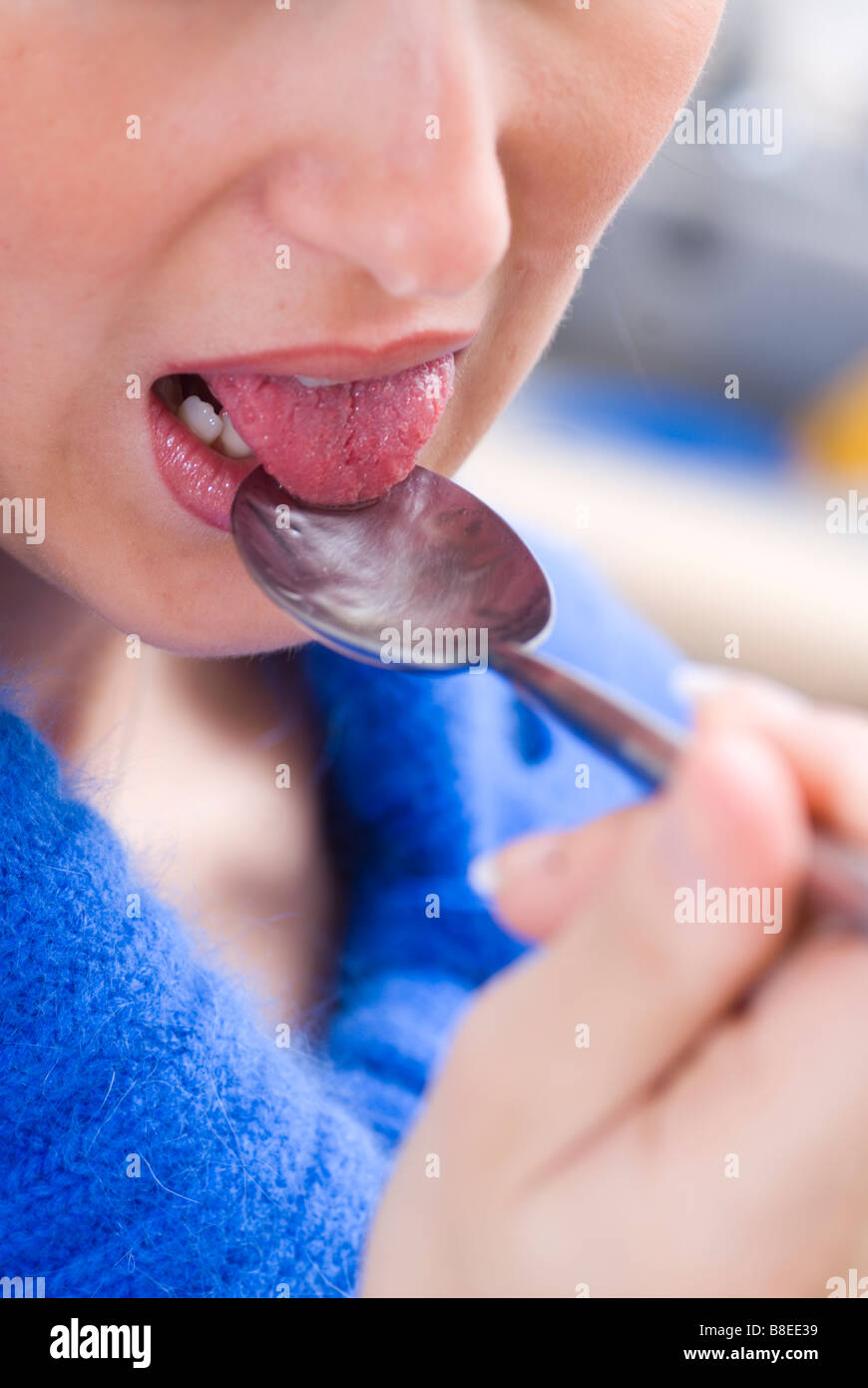Woman Licking Spoon Stock Photos &