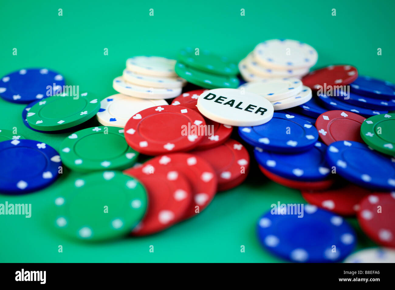 Poker chips and dealer chip Stock Photo Alamy
