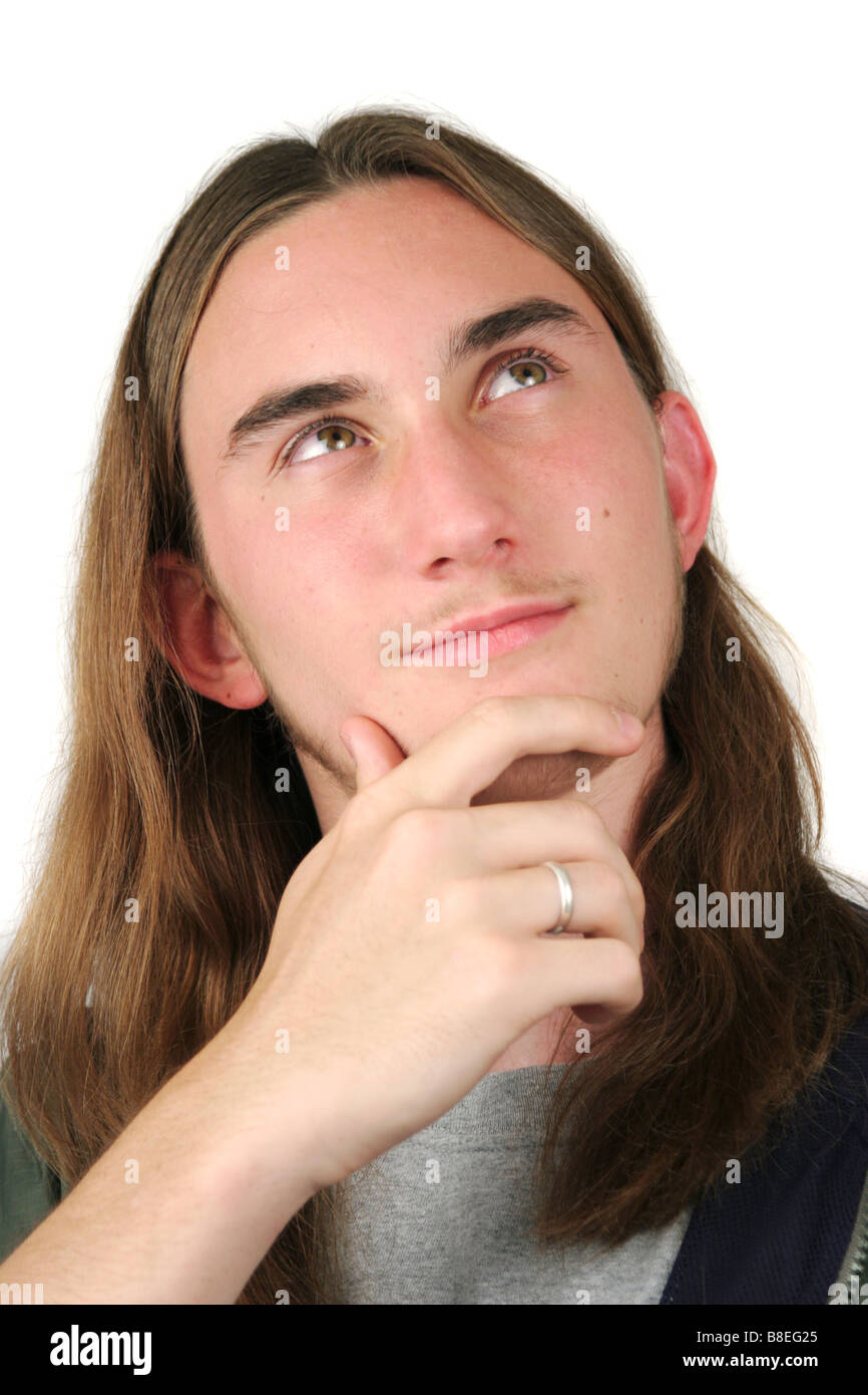 Late Teen Male With Long Hair Thinking About Something Stock Photo