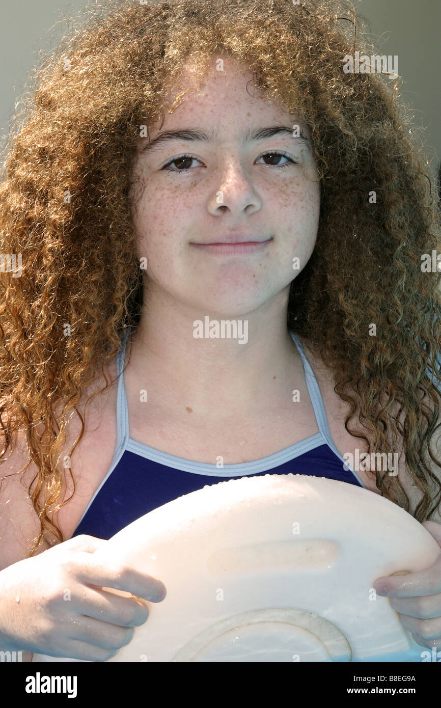 young girl with curly hair, swimming Stock Photo Alamy