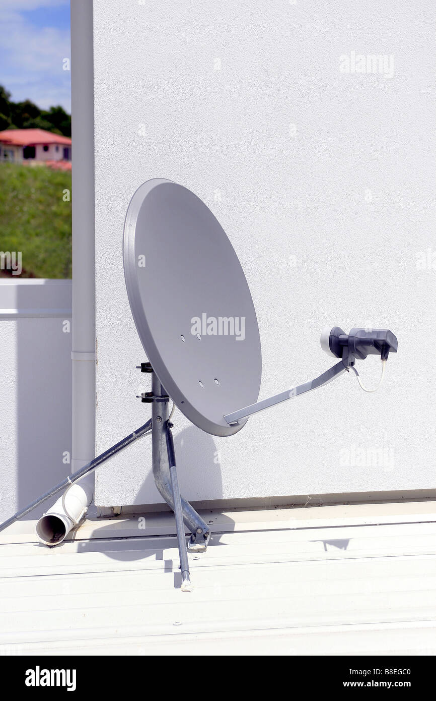 satellite reciever dish on flat roof Stock Photo Alamy