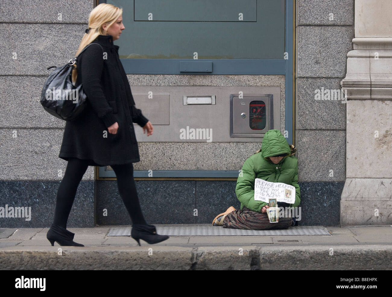 beggar and pedestrian Stock Photo