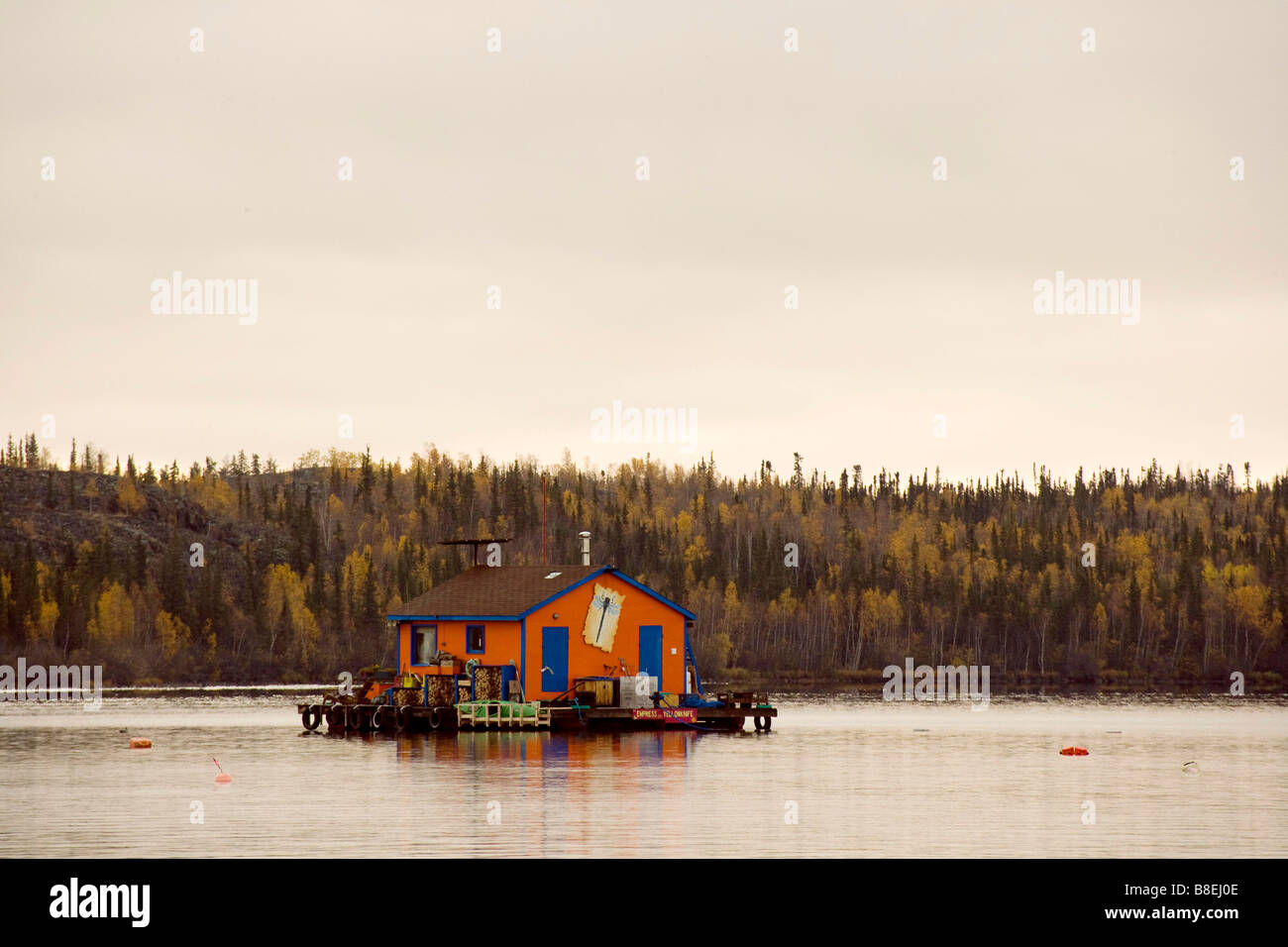 Orange coloured houseboat on Great Slave Lake, Yellowknife Northwest