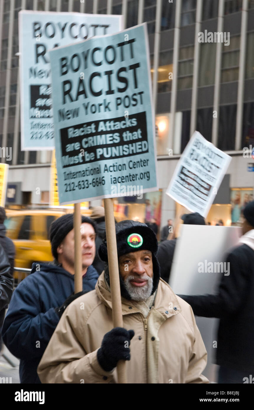 People gather outside the News Corporation on 2-20-09 to protest the publication of a racist cartoon in the NY Post Stock Photo