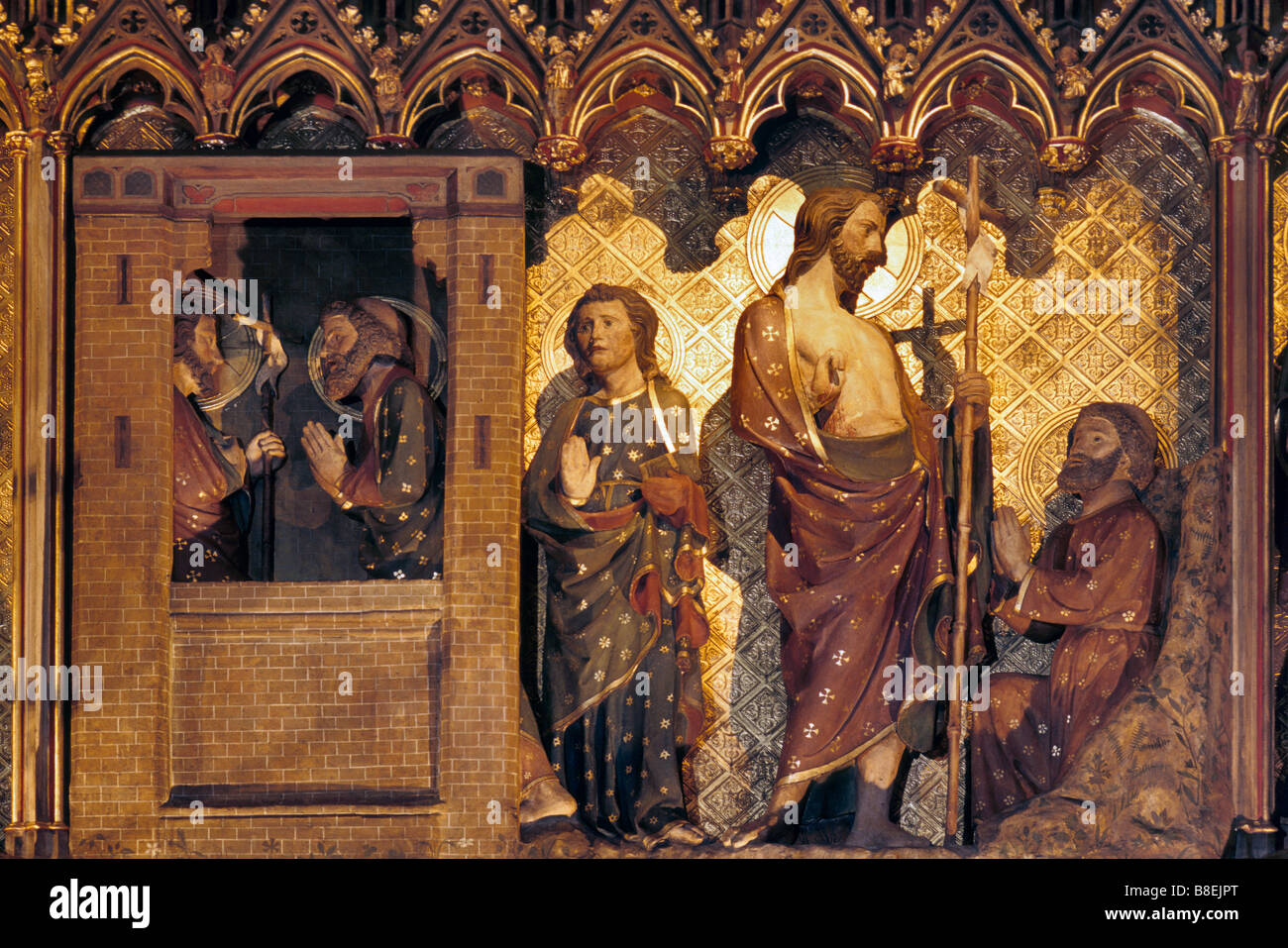 Wood sculptures depicting life of Jesus Christ on side of chancel inside Notre Dame in Paris France Stock Photo