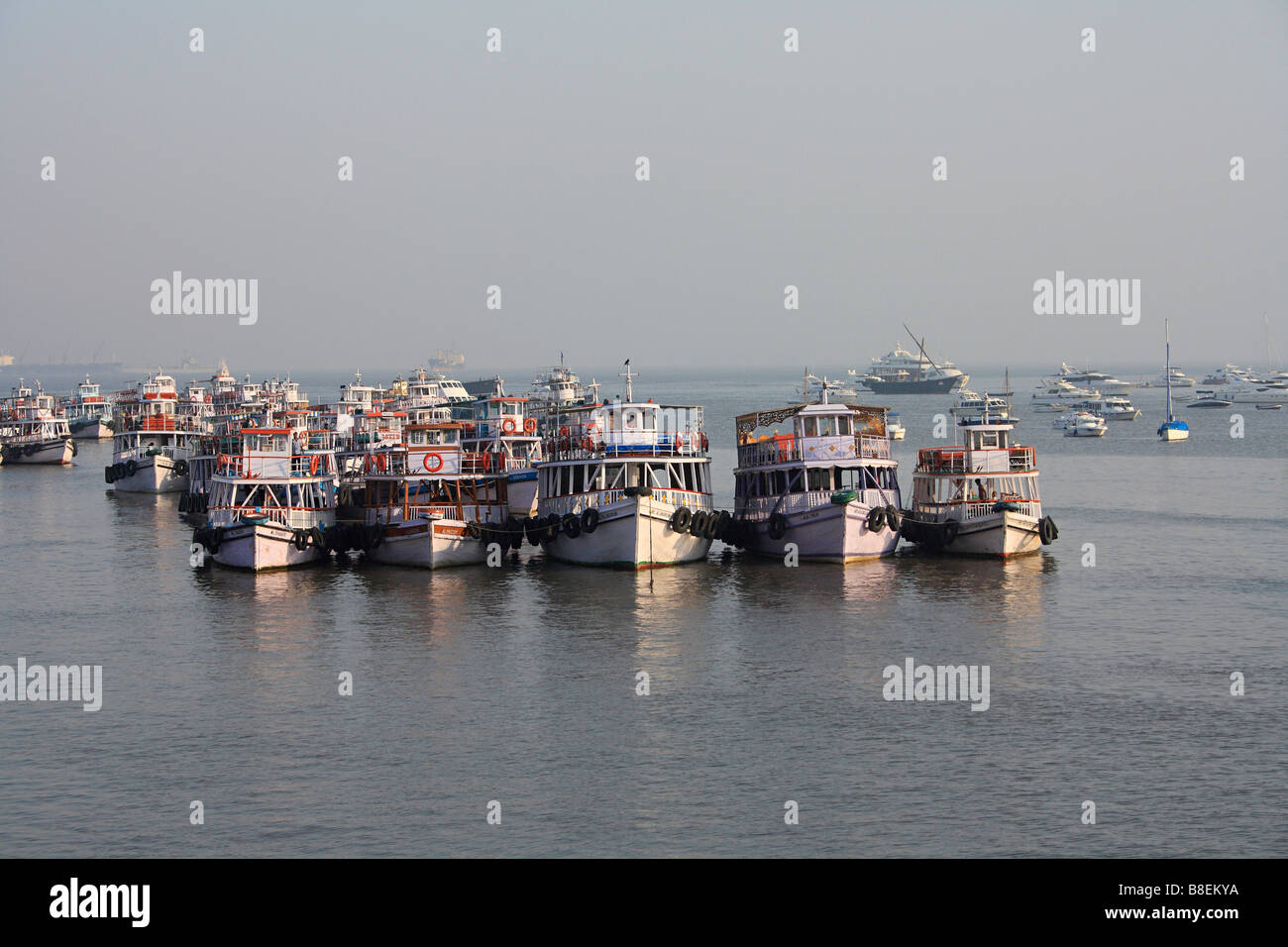 Harbor ferries by Gateway of India in late afternoon, Bombay Maharashtra, India Stock Photo