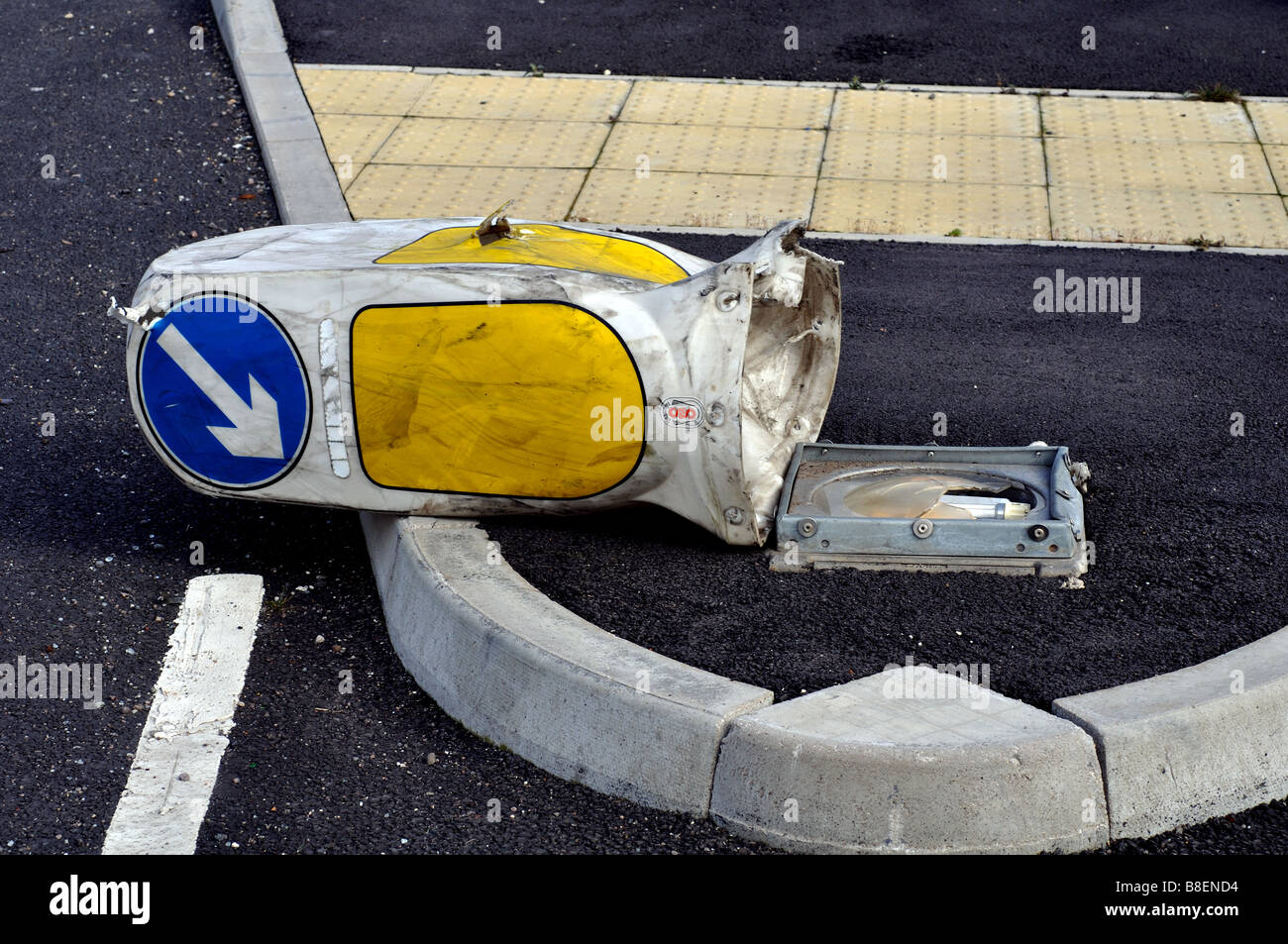 Keep left bollard knocked over, UK Stock Photo