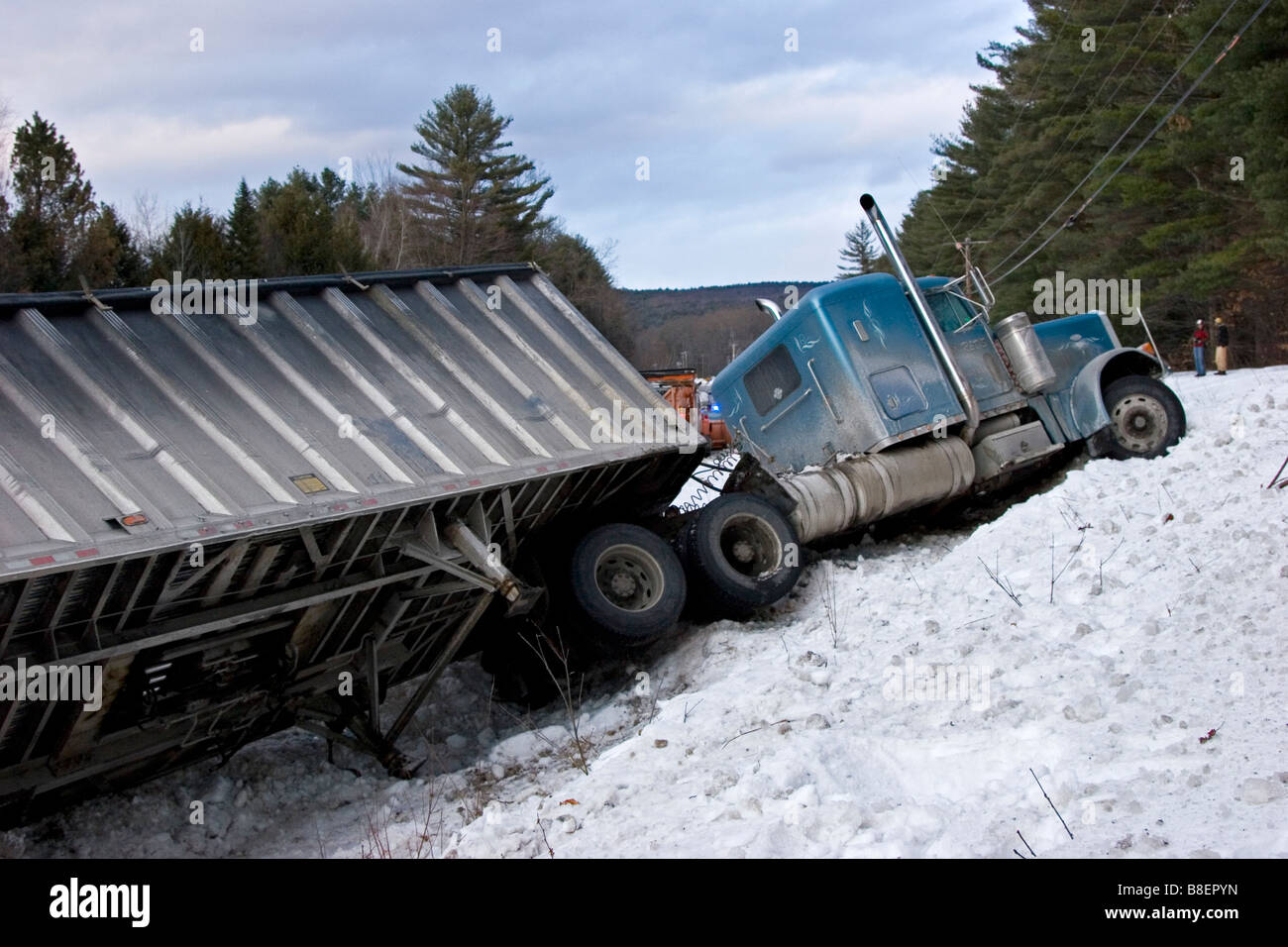 Semi truck in ditch in snow Stock Photo