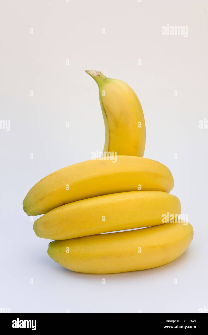 Bunch of bananas on white background making a 'thumbs up' gesture with space around subject for copy or graphic Stock Photo