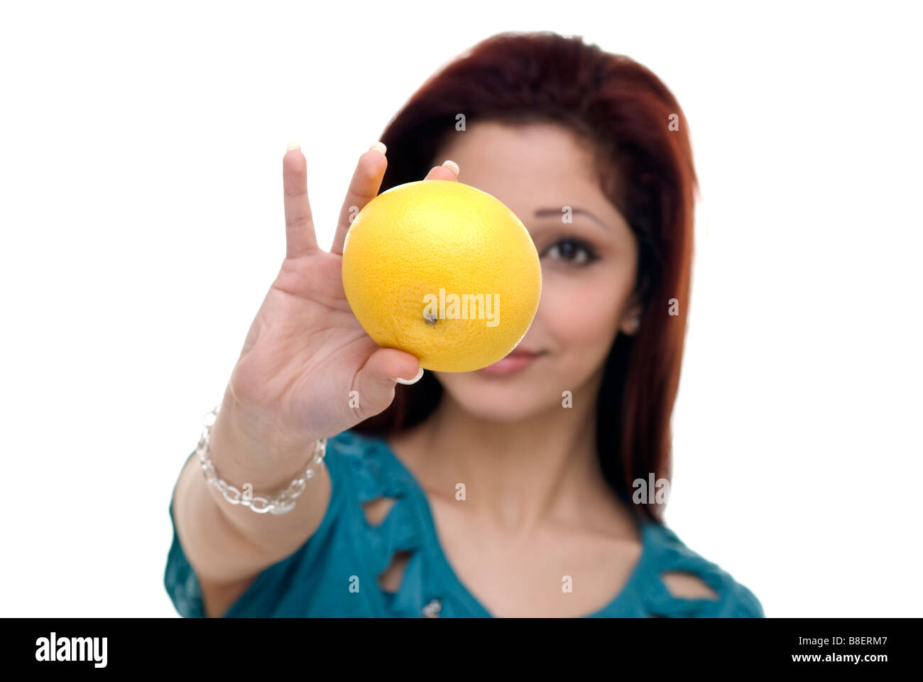 woman holding a grapefruit Stock Photo