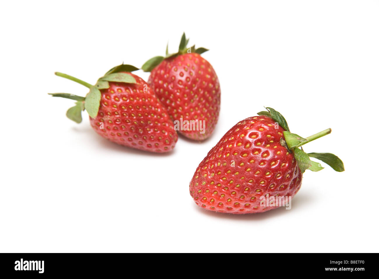 Strawberries isolated on a white studio background Stock Photo - Alamy