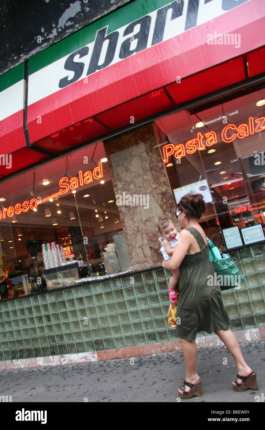 Mother carrying baby in New York City Stock Photo Alamy