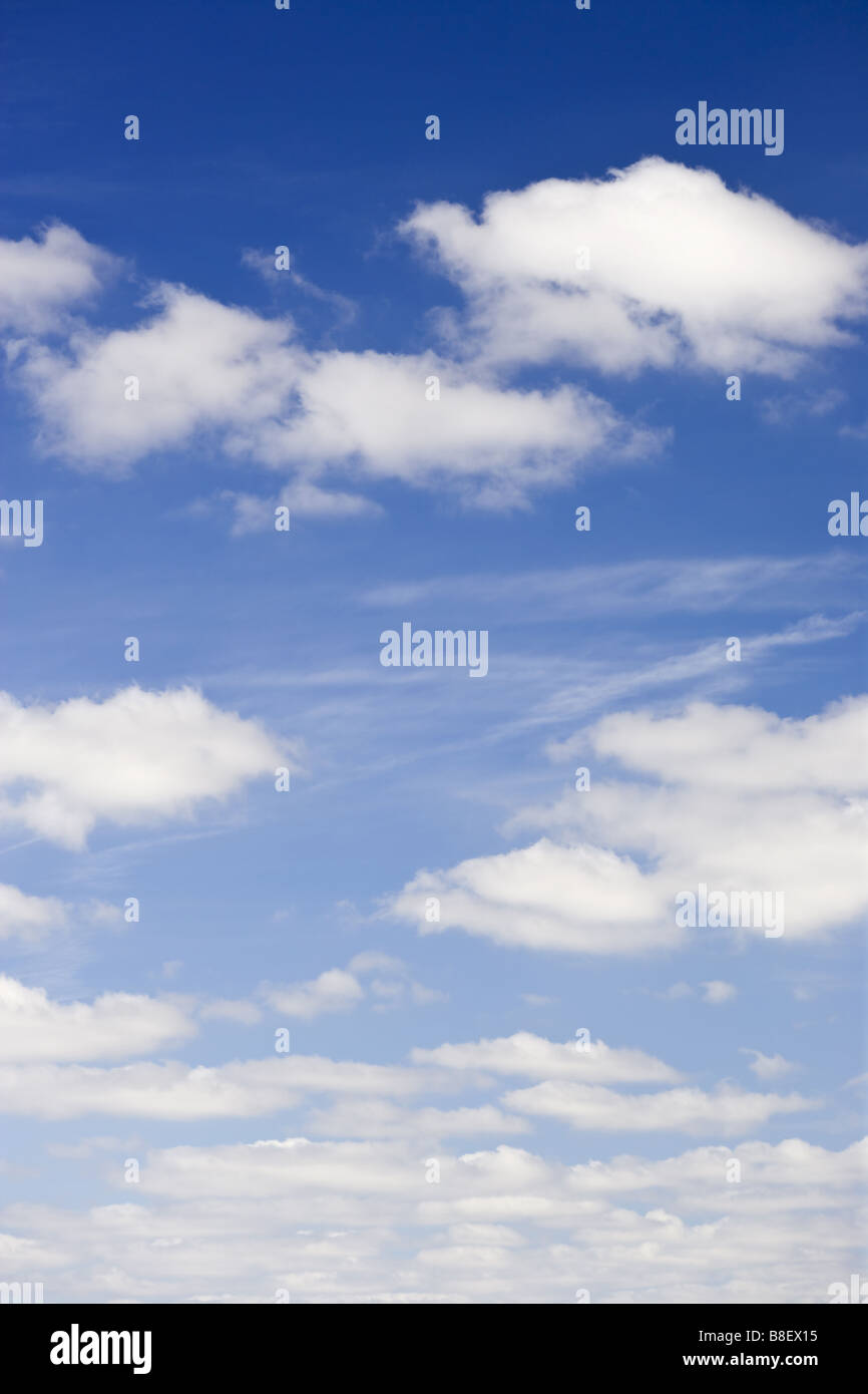 blue sky with white fluffy clouds background Stock Photo - Alamy
