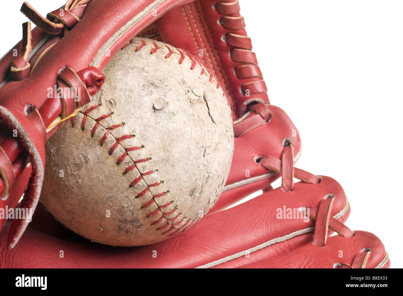 old baseball in leather mitt or glove Stock Photo