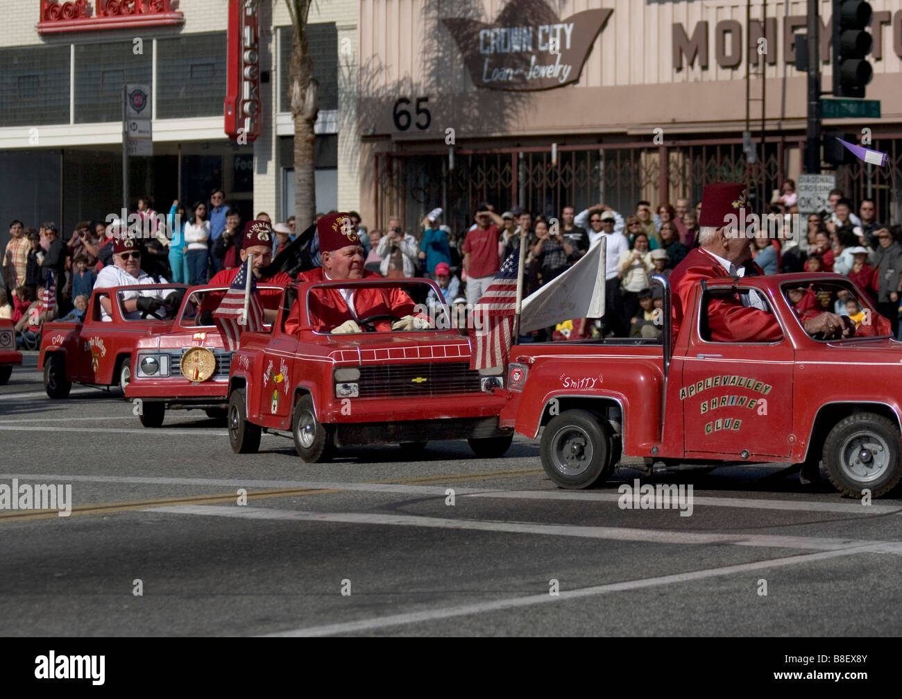 Apple Valley Shrine Club miniature cars race in circles on the parade