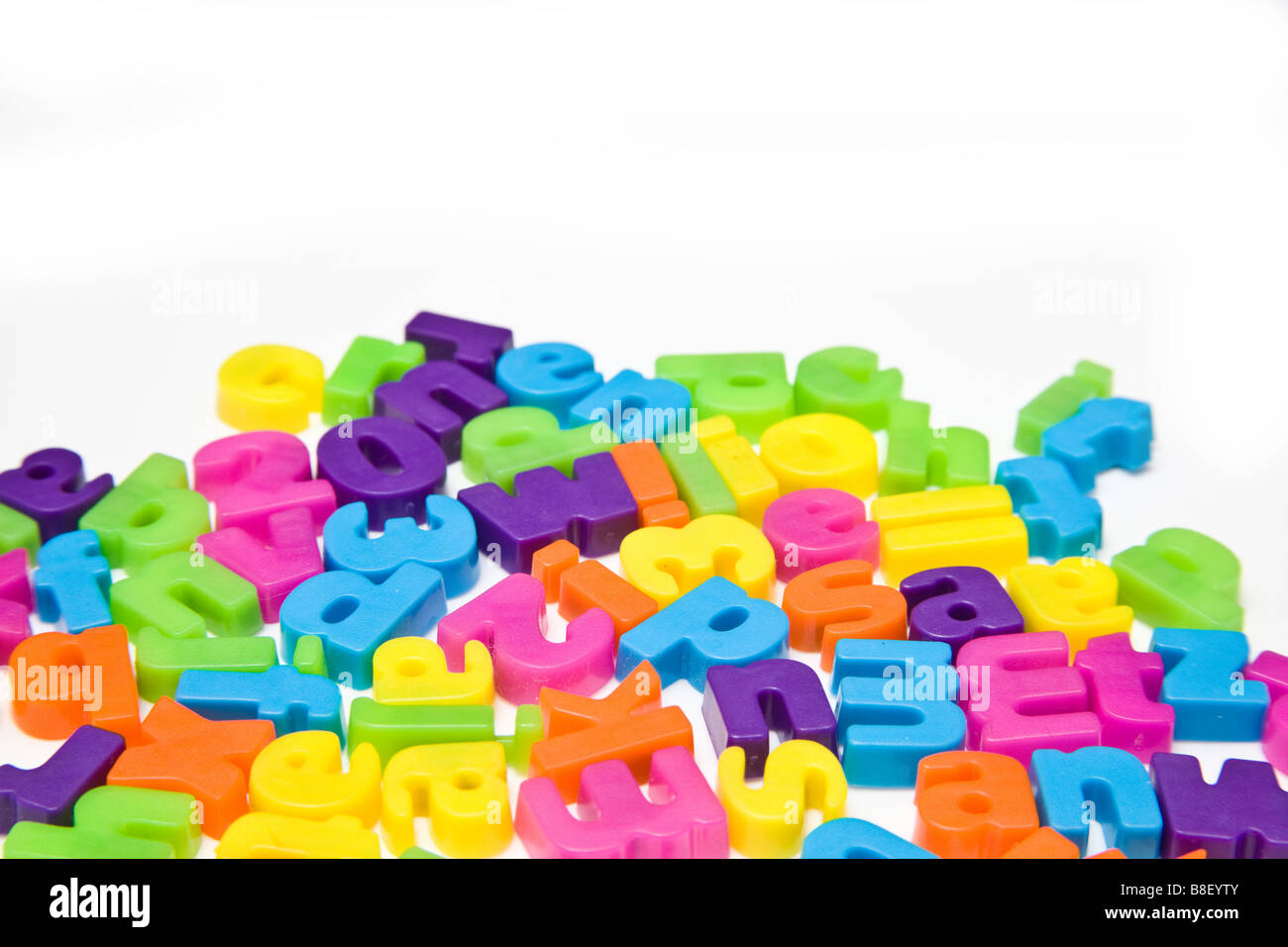 Magnetic letters isolated on a white studio background Stock Photo - Alamy