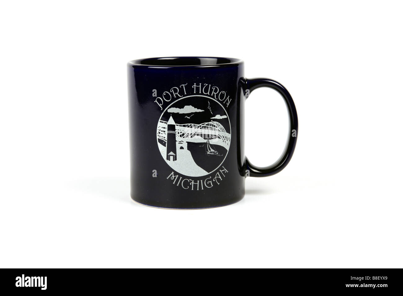Blue drinking mug with the logo of Port Huron Michigan printed on it against a white background Stock Photo