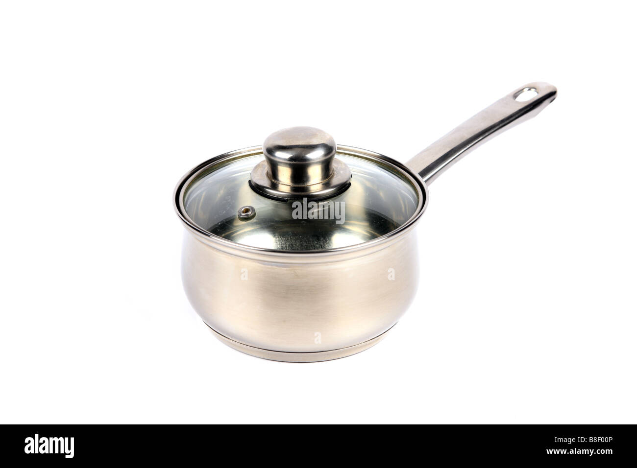 Single Stainless Steel Saucepan with glass lid against a white background Stock Photo