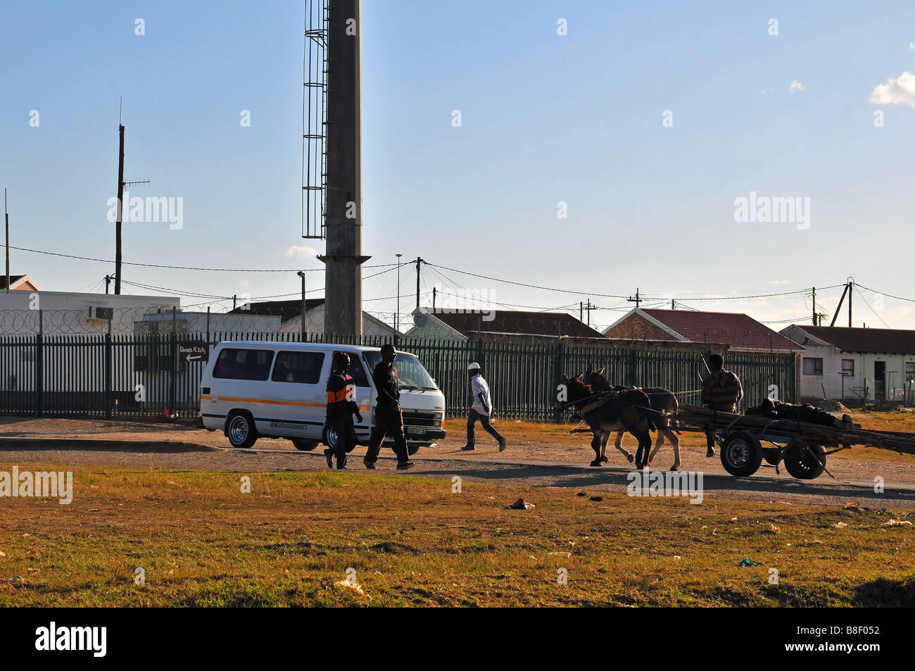 Minibus taxi and donkey cart transport in the townships of Grahamstown, South Africa Stock Photo