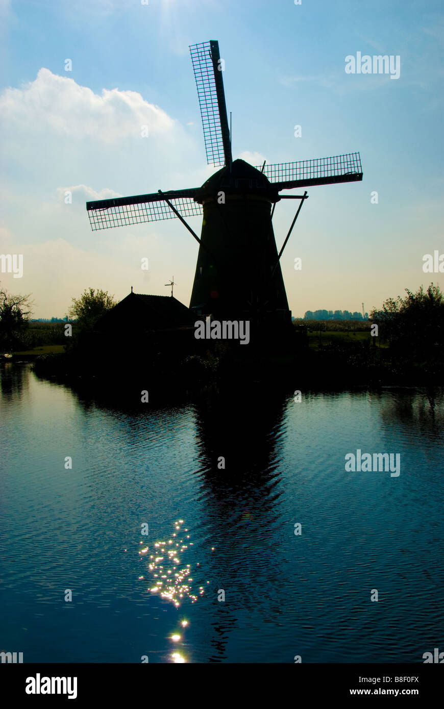 Silhouette of Traditional Dutch Windmill against a deep blue sky Stock ...