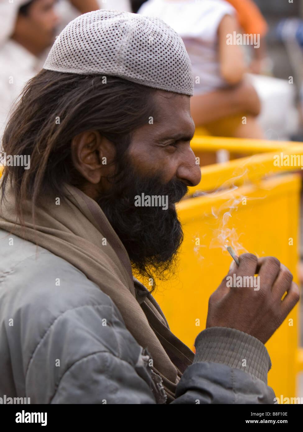 Muslim Indian man in skull cap, smoking; Delhi, India Stock Photo - Alamy
