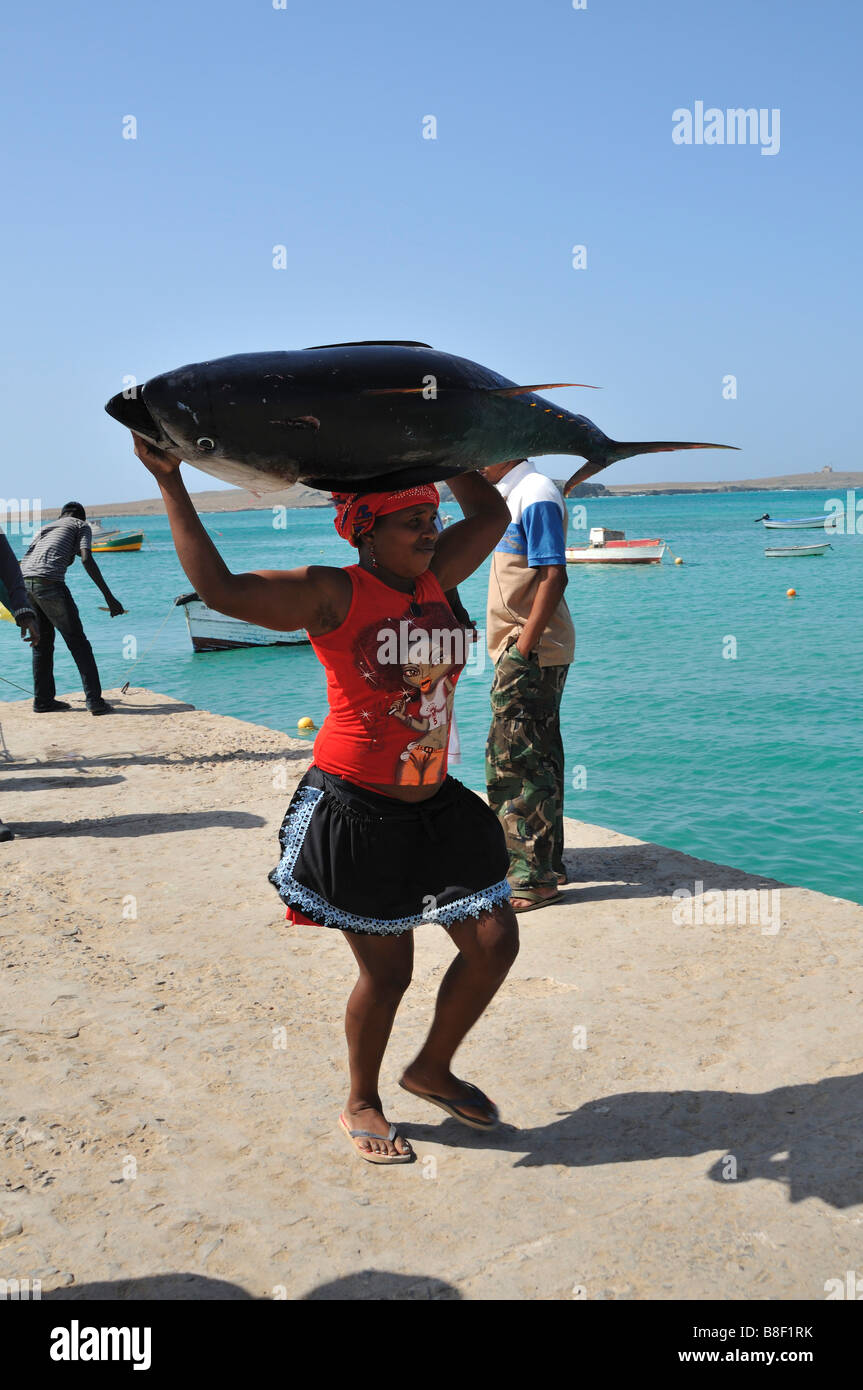 Woman carrying a tuna on her head, Sal Rei, Boa Vista Island, Republic of Cape Verde Stock Photo