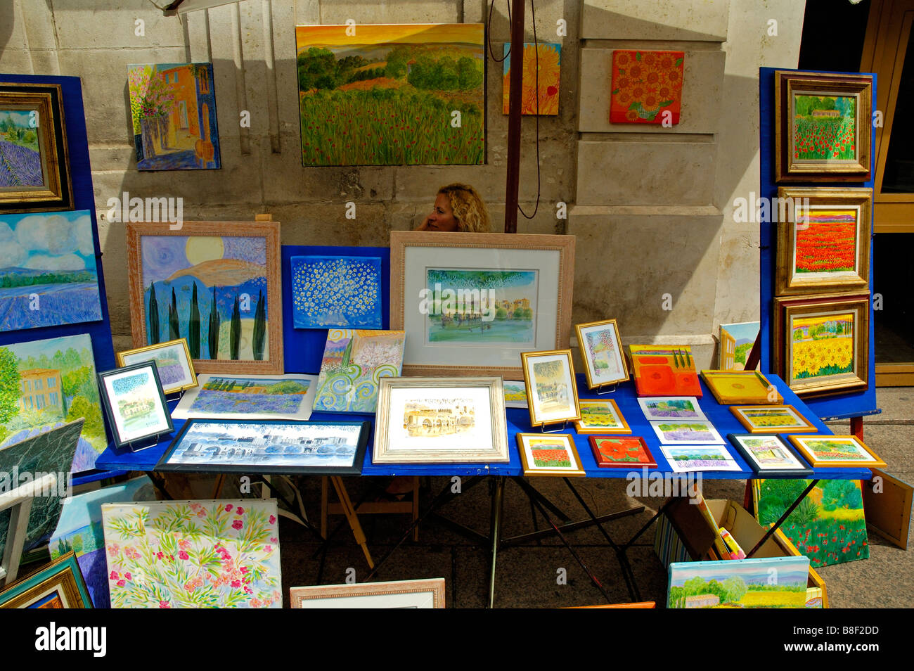 Paintings for sale on a market stall, Avignon, Provence, France. Stock Photo