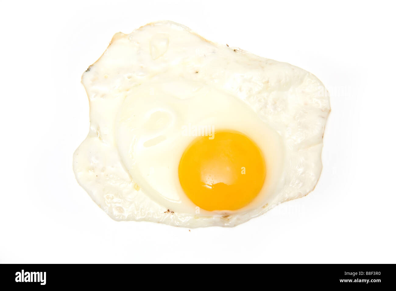 Fried egg isolated on a white studio background Stock Photo - Alamy