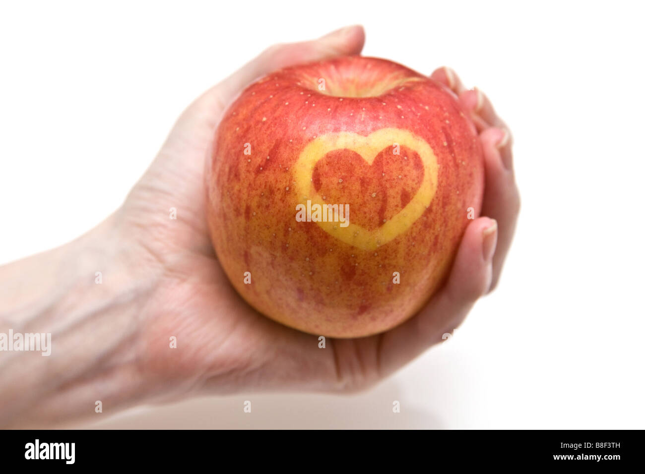 https://c8.alamy.com/comp/B8F3TH/fuji-apple-with-a-heart-design-on-the-skin-B8F3TH.jpg