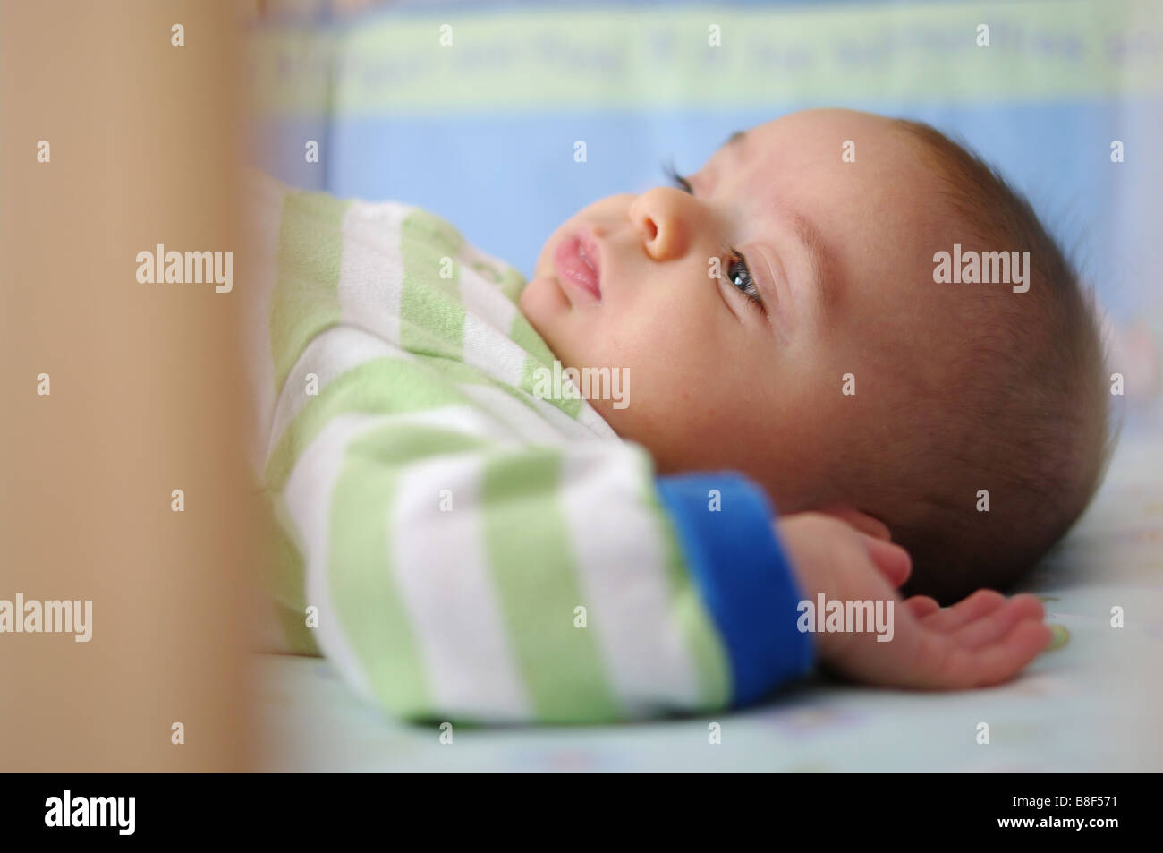 Baby in crib Stock Photo Alamy