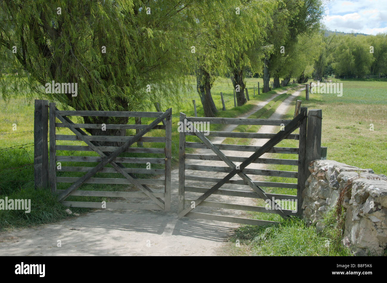 A gated pathway for cars leading to a residence; Iza, Colombia Stock Photo