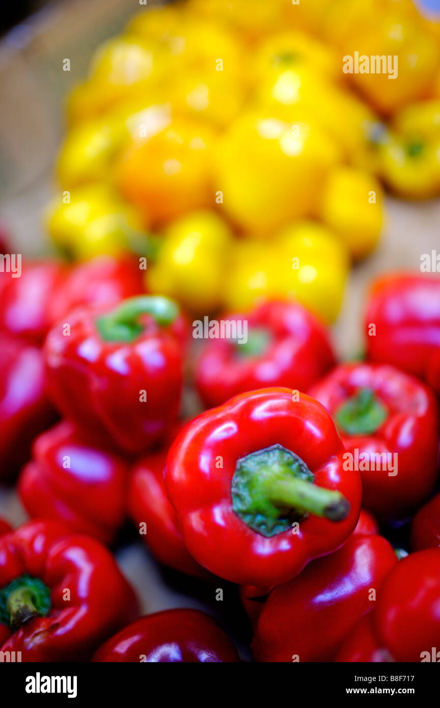 Piles of red and yellow bell peppers Stock Photo - Alamy