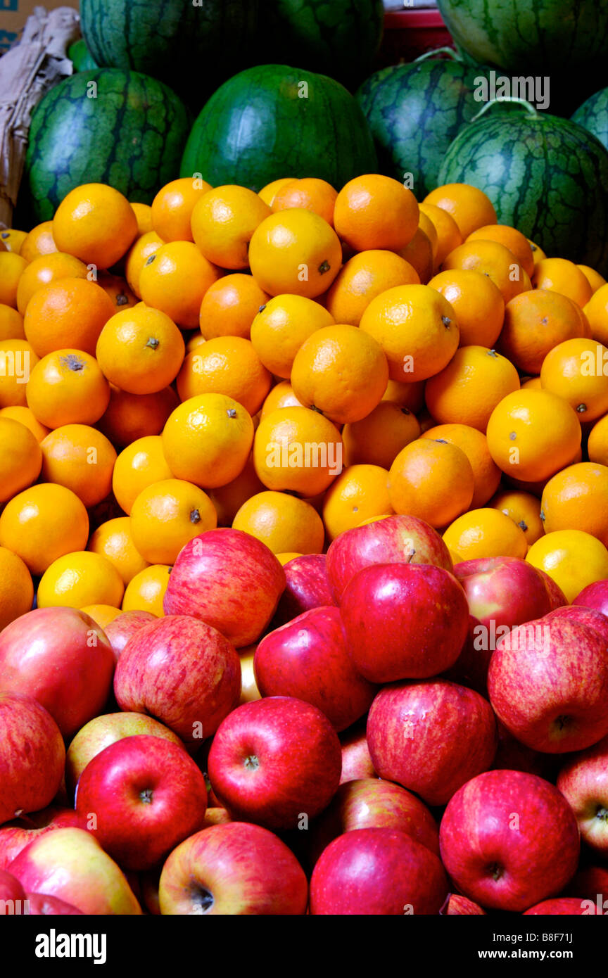 Fresh apples oranges and watermelons on display at a market stall Stock Photo Alamy